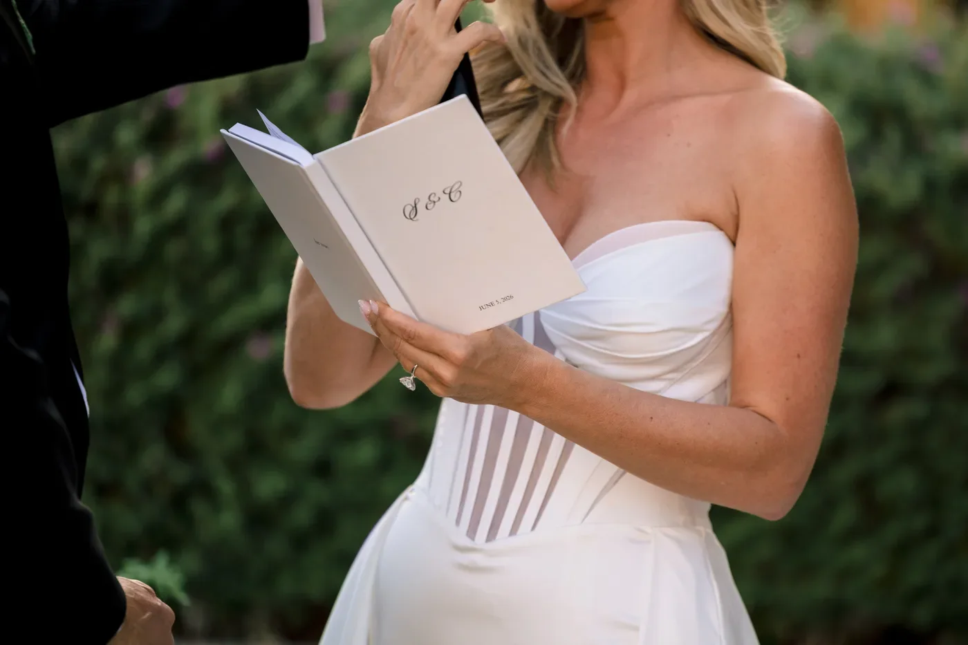 Crystal reading from the monogrammed vow book